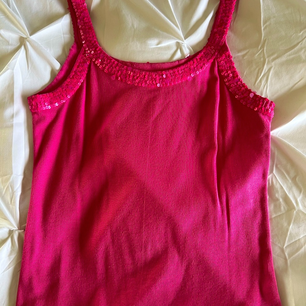 Pink camisole with sequins around the collar.